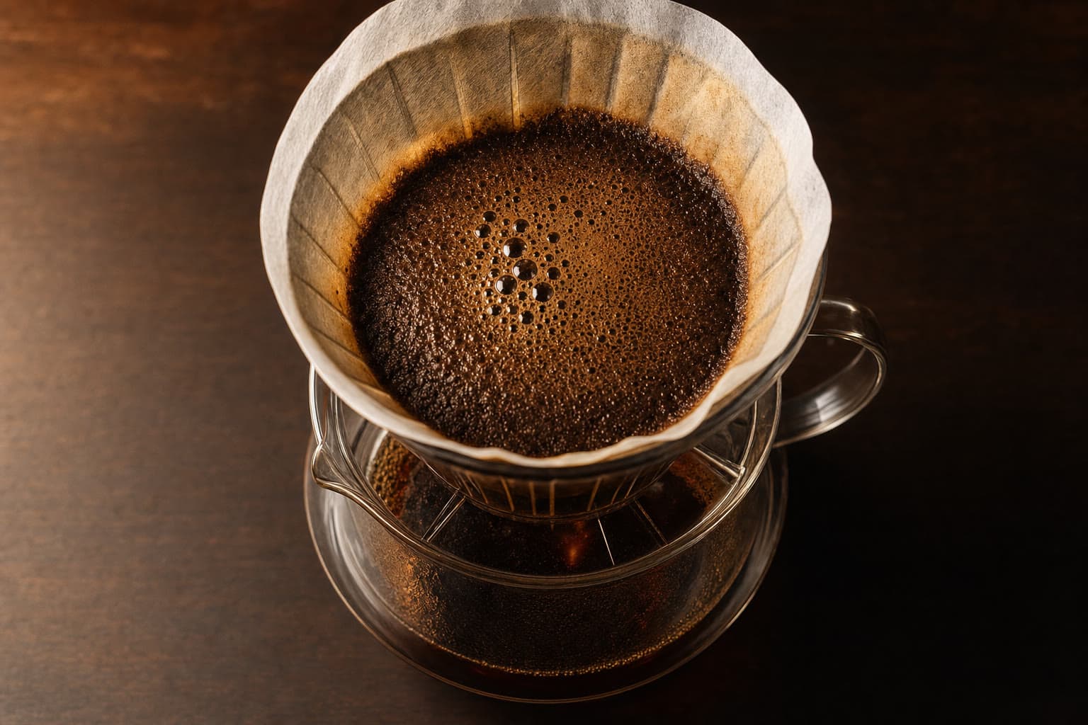 Pour-over coffee dripping into a glass carafe