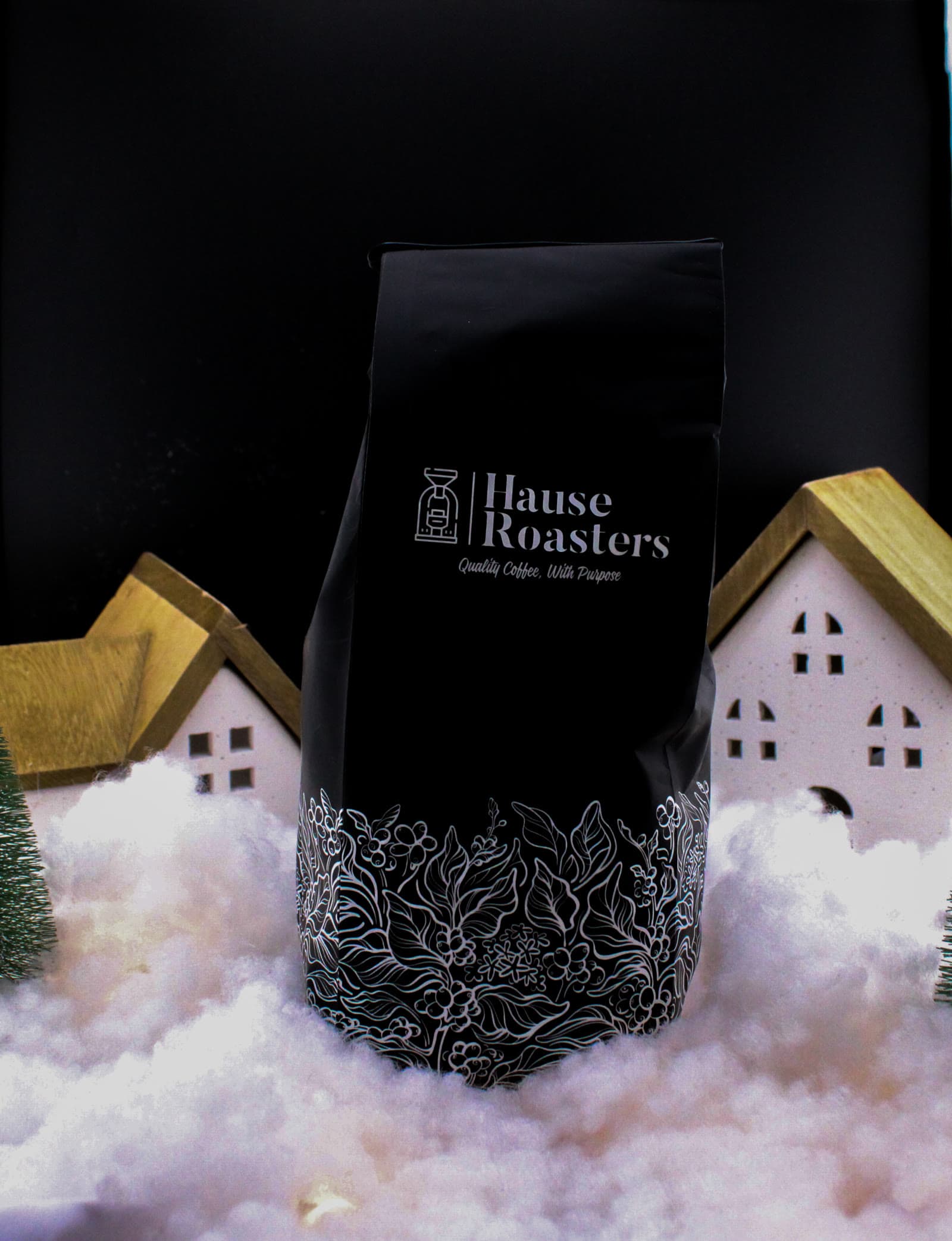 Hulia Regional Hause Roasters bag standing in a winter table scene